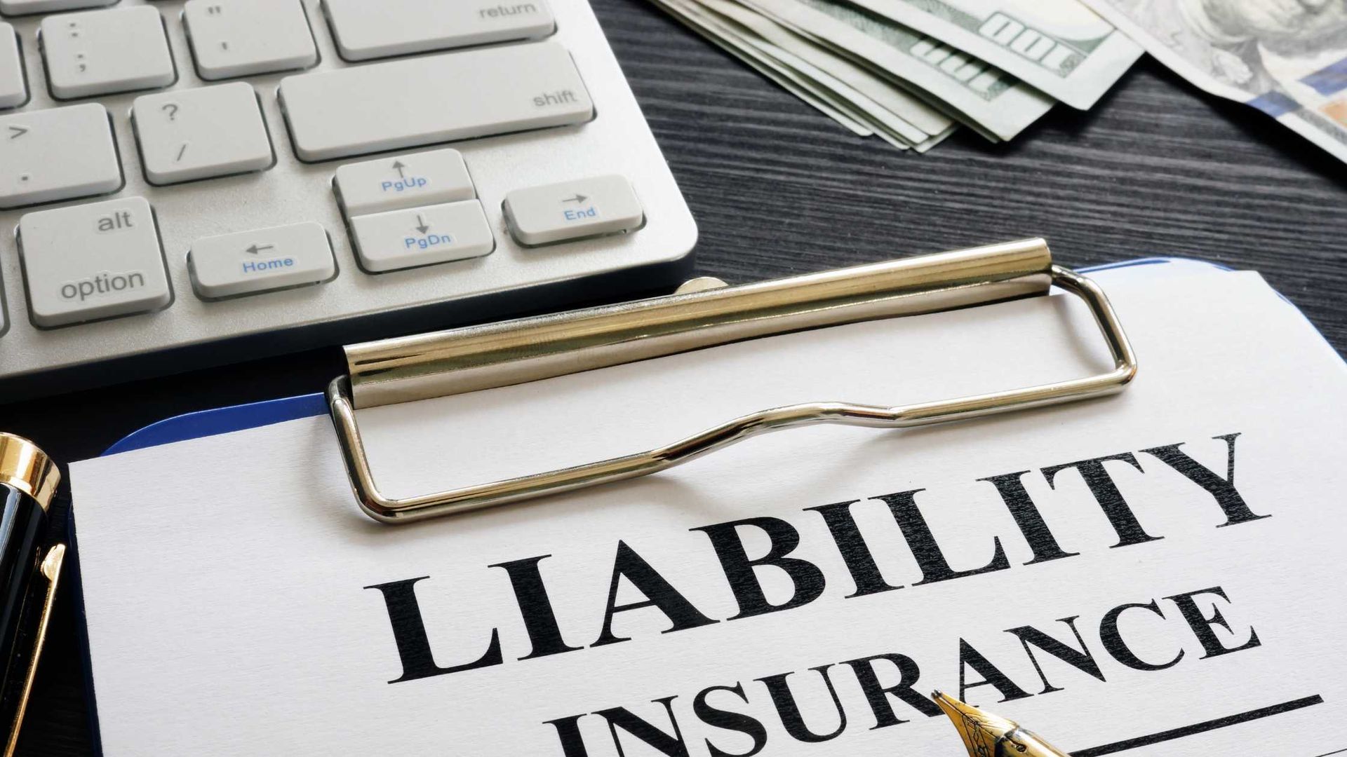 Clipboard with liability insurance written on it